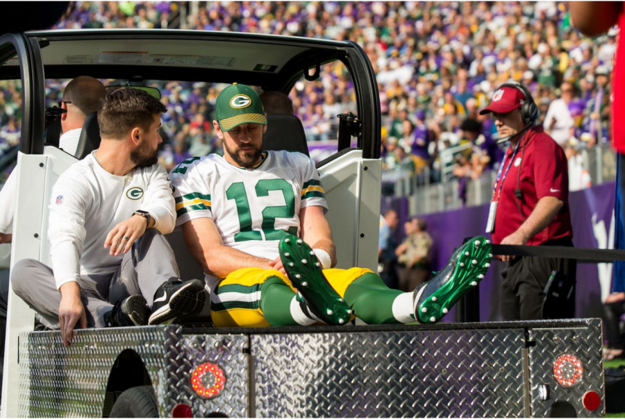 Rodgers being carted off due to broken collarbone (Brad Rempel-USA TODAY Sports)
