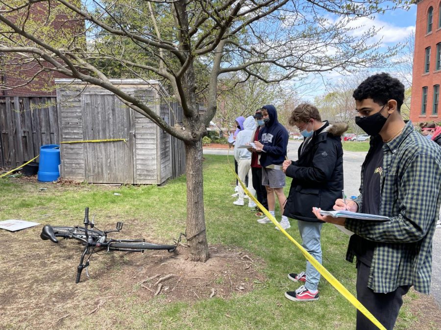 Students in Mr. Aguiars Forensic Science class take notes on a mock crime scene.